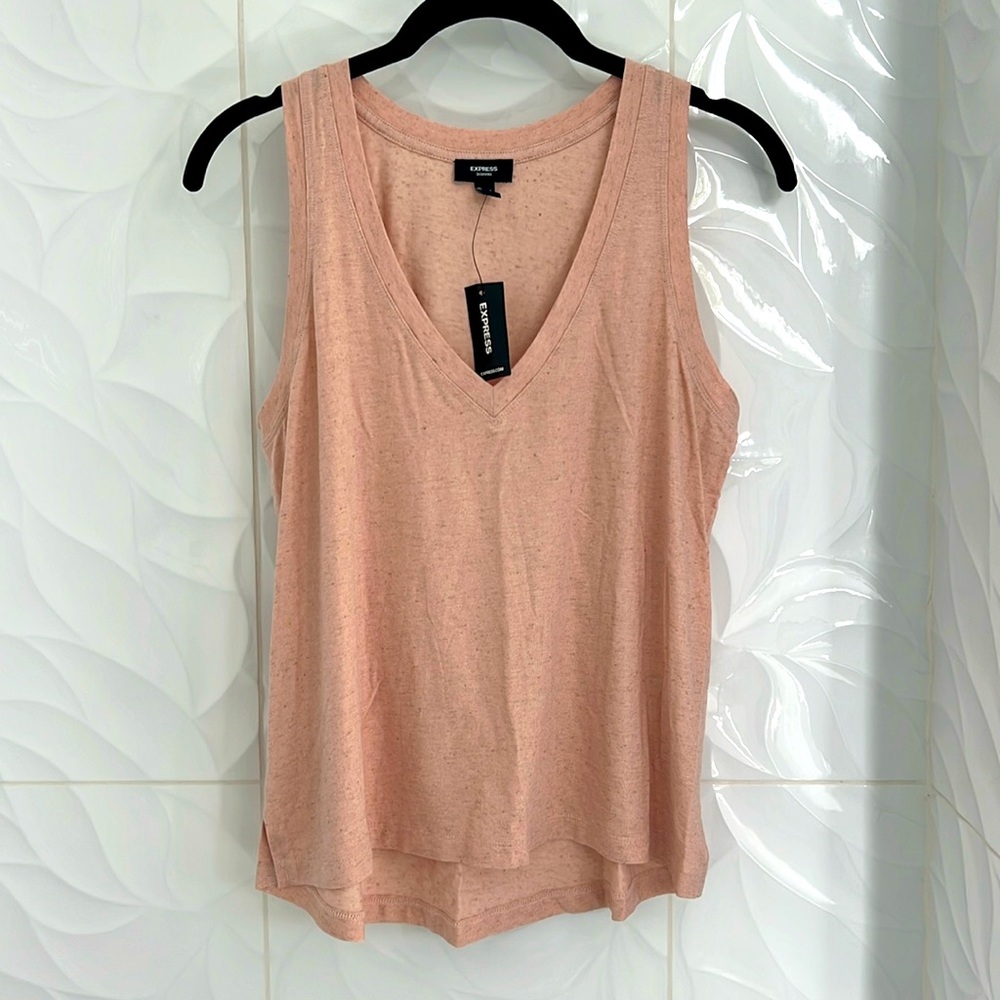 Peach colored V-neck tank top with a little hint of gold shimmer